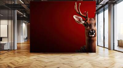 A realistic reindeer with detailed antlers adorned with holiday decorations, standing against a gradient red background. Wall mural