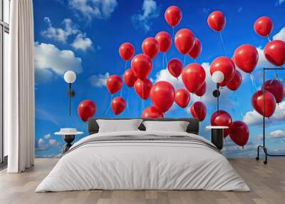 Close-up shot of red flying balloons against the blue sky Wall mural