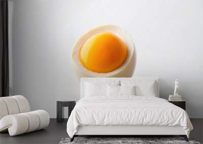 Half of a chicken egg isolated on a white background with a minimalist approach featuring a smooth surface and a clear division between the yolk and the egg white, smooth, protein Wall mural