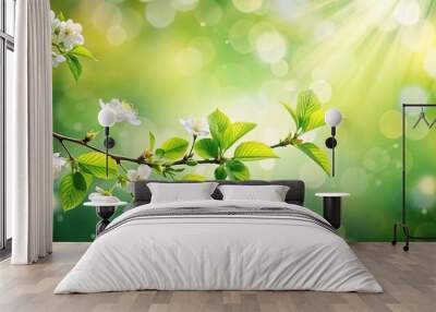 Minimalist spring scene with green leaves, blossoms, and radiant bokeh light Wall mural