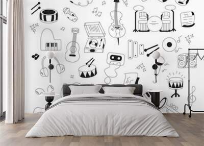 Hand drawn a music doodle. Musical instruments, notes, and headphones in sketch form. Vector illustration isolated on white background Wall mural