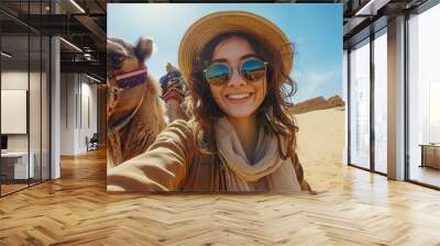 portrait of a woman taking a selfie with a camel Wall mural