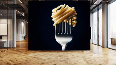 spaghetti noodles with a fork, isolated against a dark background Wall mural