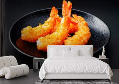 breaded Torpedo shrimps on black japanese plate on black background Wall mural