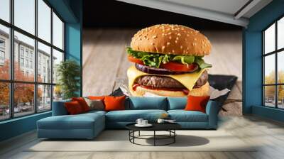 Cheeseburger with beef,tomato, lettuce and onion on wooden table Wall mural