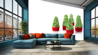 Christmas tree cupcakes isolated on white background. Copy space Wall mural