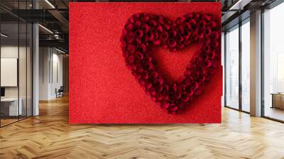 Heart made of red roses on red bright background for Valentine's Day. Copyspace

 Wall mural