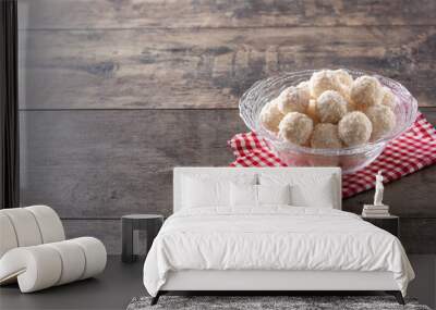 Homemade coconut balls in crystal bowl on wooden table	 Wall mural