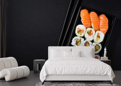 Japanese food: maki and nigiri sushi set on black background. Flat lay top-down composition. Copyspace Wall mural