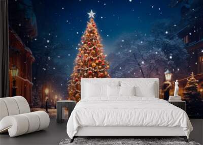 large illuminated christmas tree in the city at night Wall mural