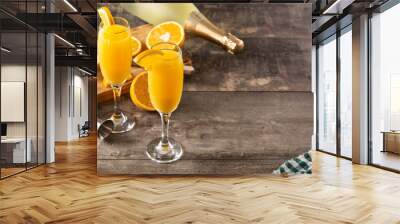 Orange mimosa cocktail on wooden table. Copy space Wall mural