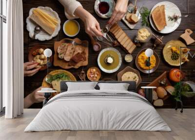 several people eating kosher food on a wooden table. top view. Ai generative Wall mural