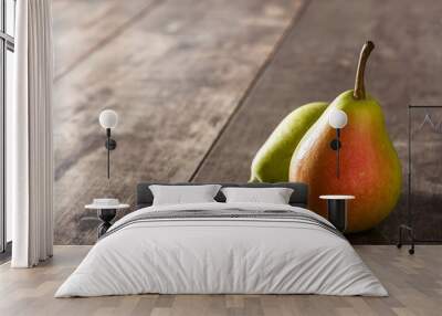 Two pears on wooden table. Copy space Wall mural