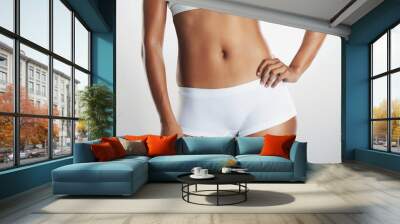 Health, underwear and stomach of woman in studio for weight loss, wellness and exercise on white background. Self care, fitness and isolated abdomen of person for workout, diet and slim figure Wall mural