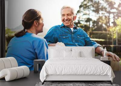 This is just what I needed. Cropped shot of a young female nurse outside with a senior patient in a wheelchair. Wall mural