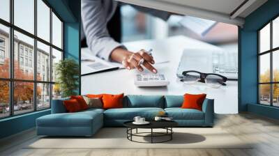 Accountant, businesswoman or banker using calculator, checking paperwork and documents while preparing financial data report in an office. Hands of a woman doing payroll or calculating annual tax Wall mural