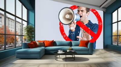 Megaphone, stop and man with protest, speech and justice on a white studio background. Person, model or activist with a bullhorn, rejection or graphic sign for warning, speaker for equality or change Wall mural