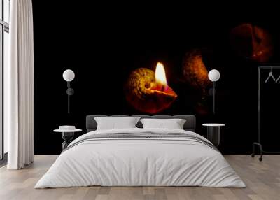 Candle on dark background. Wall mural