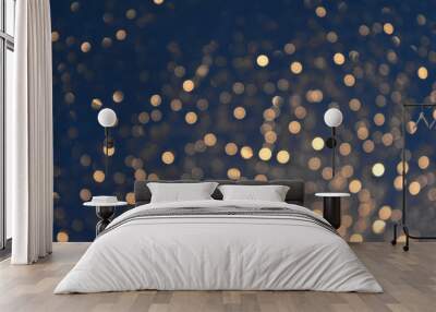 Glittering bokeh circular gold on blue background. Wall mural