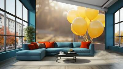 A bunch of yellow balloons tied to a fence, floating in the breeze at an outdoor celebration Wall mural