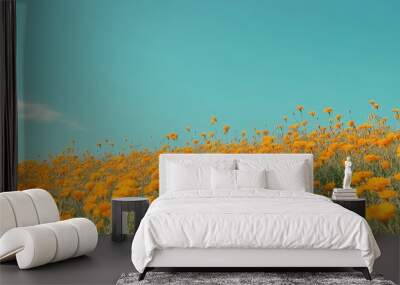 A field of bright yellow marigolds under a clear blue summer sky, showcasing vibrant seasonal colors Wall mural