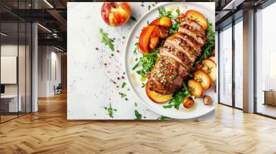 Baked pork tenderloin with quince or apple slices served on plate. White table background, Wall mural