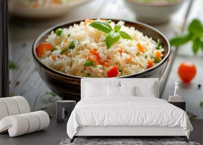 Bowl of delicious rice with vegetables served on white wooden table, closeup Wall mural