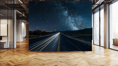 Car trails streaking through a dark highway under a starry night sky Wall mural