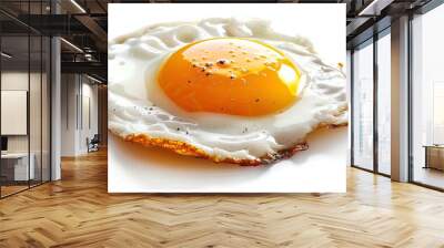 Close-up of a perfectly fried egg with yellow yolk, isolated on white background, classic breakfast Wall mural