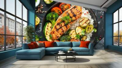 Healthy lunch bowl with grilled salmon, rice and vegetables. Grilled zucchini, broccoli and tomato with salmon steak and rice Wall mural