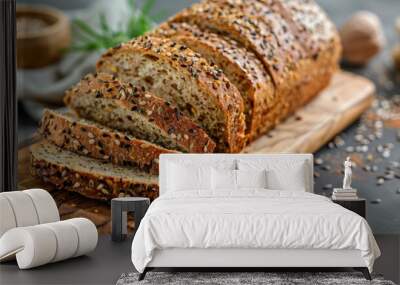 Multi grain sourdough bread with flax seeds cut on a wooden board, Wall mural