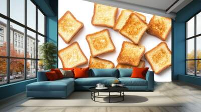 Top view of pieces of fresh toast bread isolated on a white background, showcasing their golden-brown texture and crispy edges Wall mural