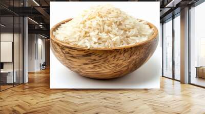 Uncooked dry rice in wooden bowl isolated on white Wall mural