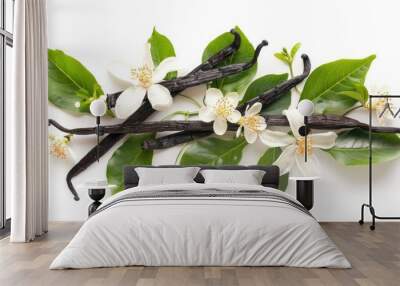 Vanilla pods and green leaves with flowers against a white background Wall mural