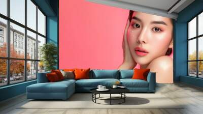 Young Asian beauty woman pulled back hair with korean makeup style touch her face and perfect skin on isolated pink background. Facial treatment, Cosmetology, plastic surgery. Wall mural