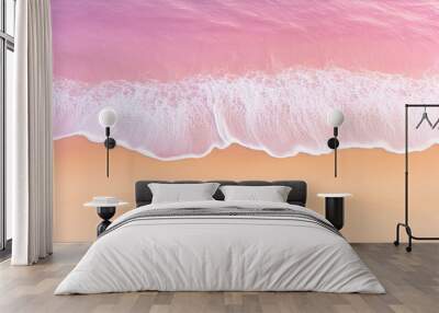 A striking aerial shot of a gentle lavender wave as it meets the pastel sands of a twilight beach Wall mural