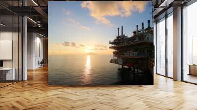 Offshore construction platform for production oil and gas with sunset sky Wall mural