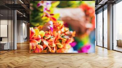 Close-up photo of a traditional Hawaiian luau, showcasing intricate leis, hula dancers, and vibrant tropical decorations, capturing the essence of this cultural festivity Wall mural