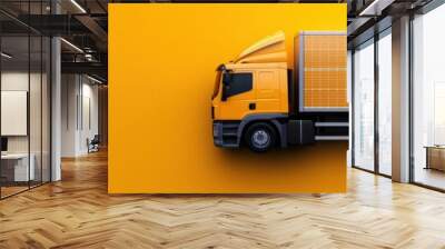 Aerial view of golden delivery truck transporting goods in industrial setting with solar panels Logistics and supply chain concept Wall mural