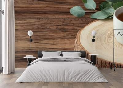 Cozy coffee cup on a wooden surface with fresh green leaves. Wall mural