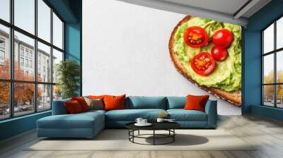 Delicious avocado toast topped with cherry tomatoes, perfect for a healthy breakfast or snack option. Wall mural