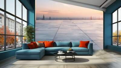 Modern rooftop terrace at sunrise with panoramic cityscape views and sleek concrete flooring. Wall mural