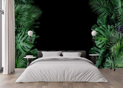 Monstera, fern, and palm leaves tropical foliage plant bush nature frame on black background. Wall mural