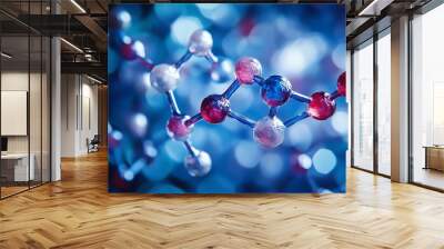 Close-up view of colorful molecular structure on a blurred blue background, showcasing interconnected atoms and scientific exploration. Wall mural