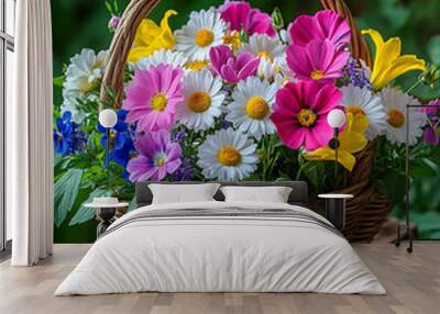 A basket full of colorful wildflowers, including pink, white, and yellow blooms, creates vibrant and cheerful display. arrangement brings sense of joy and natural beauty to any setting Wall mural