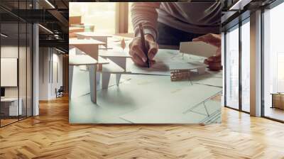 architect design working drawing sketch plans blueprints and making architectural construction model in architect studio Wall mural