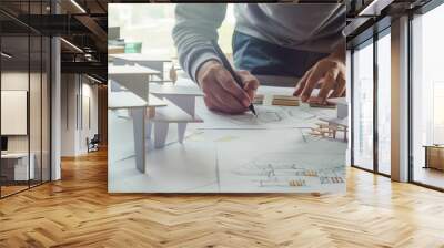 architect design working drawing sketch plans blueprints and making architectural construction model in architect studio Wall mural