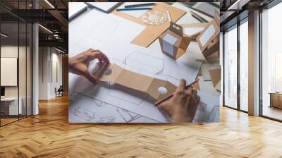 Designer sketching drawing design Brown craft cardboard paper product eco packaging mockup box development template package branding Label . designer studio concept . Wall mural