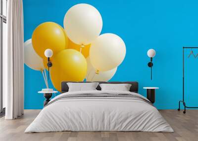 Bright yellow and white balloons floating against a clear blue sky on a sunny day Wall mural