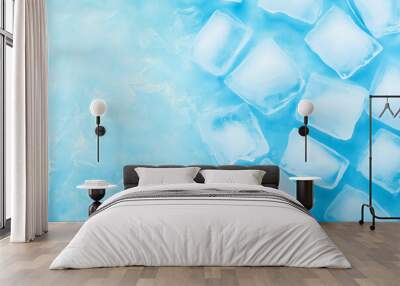 Ice cubes scattered on a light blue surface creating a refreshing chill effect Wall mural